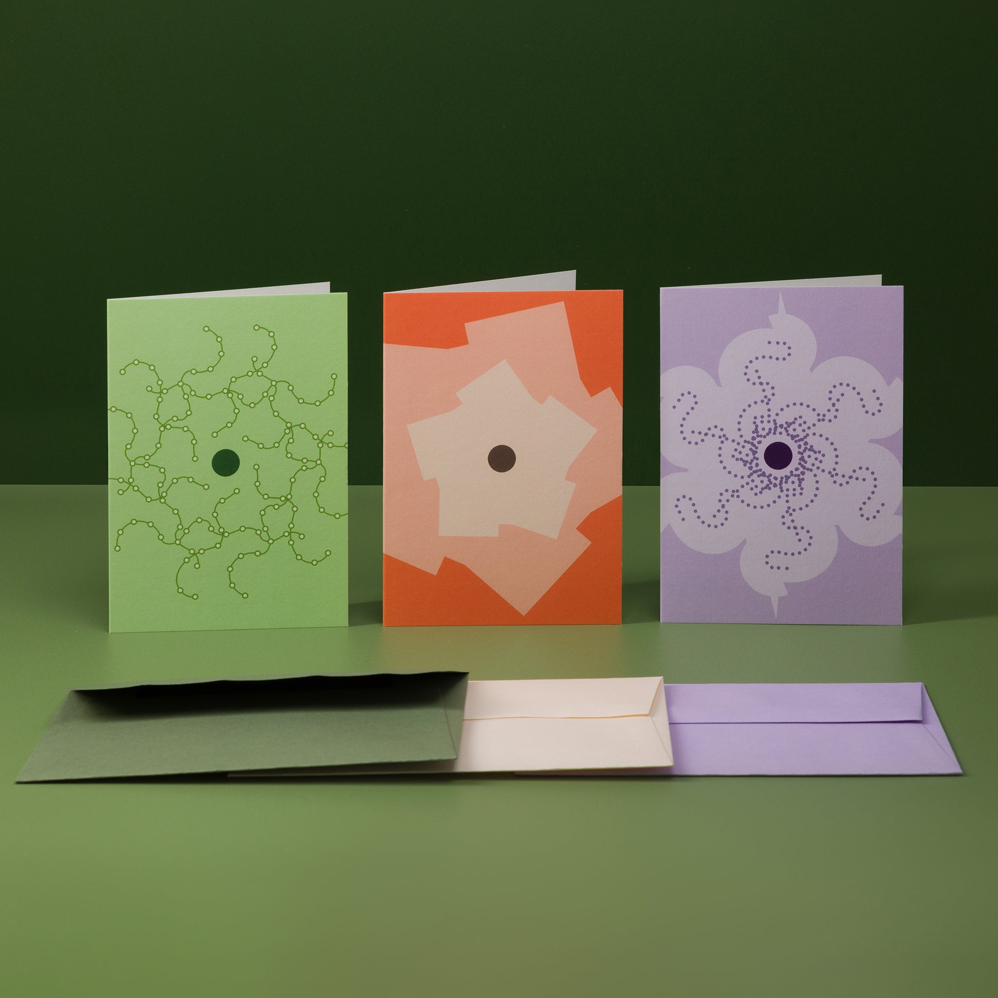 Bundle of three greeting cards from the Orbit range in three colour schemes: green, orange and lilac