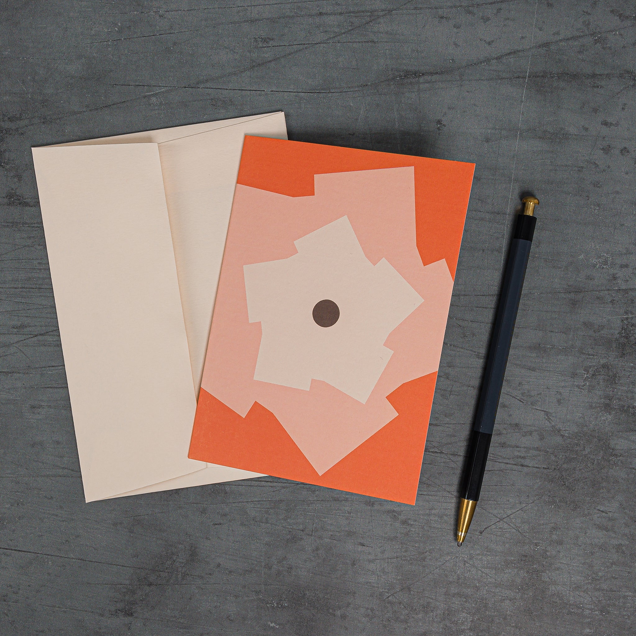 Orbit 3 greeting card, with cog-like motifs rotating around a central disc. Orange colour scheme