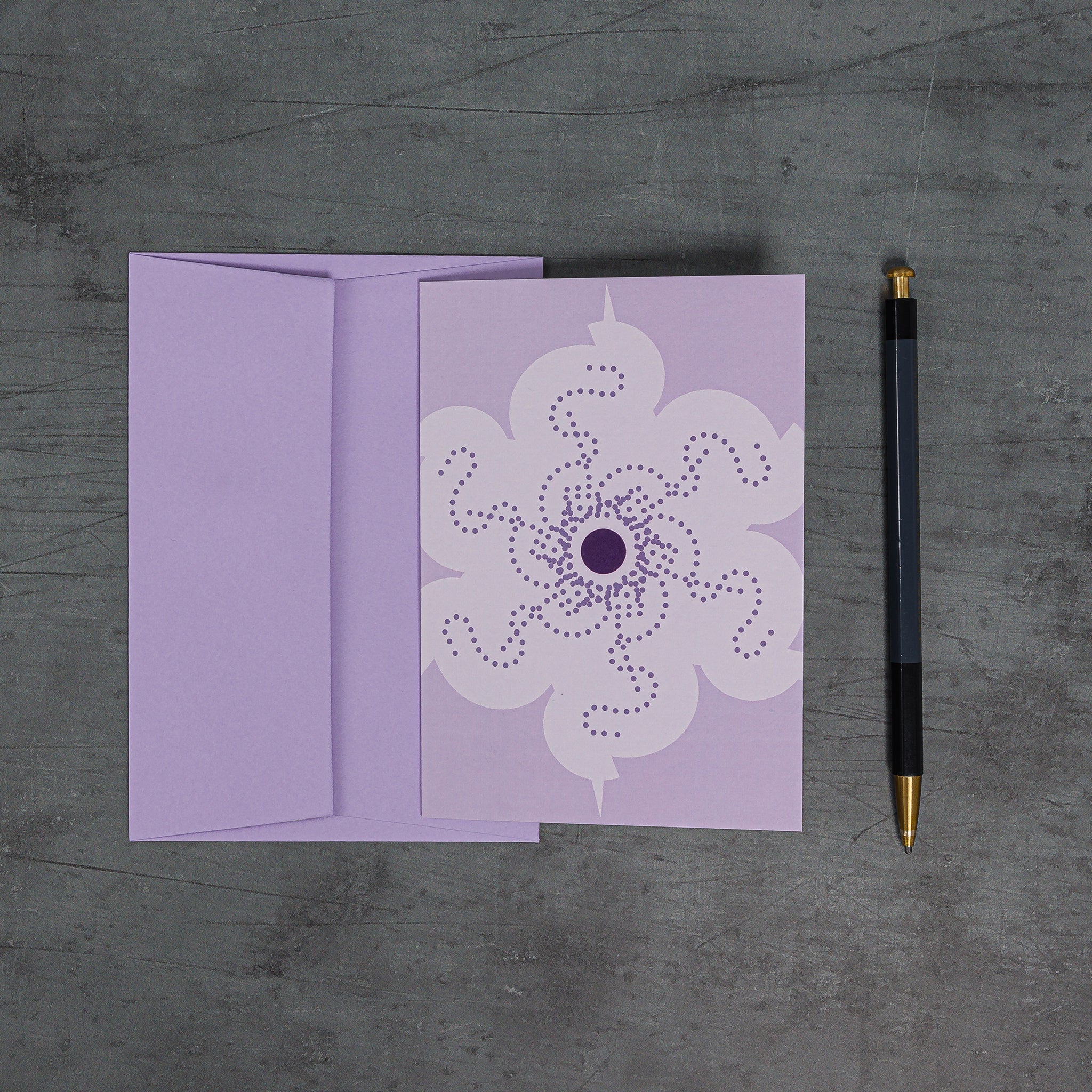 Overhead view of Orbit 2 greeting card with geometric floral motif and lilac colour scheme