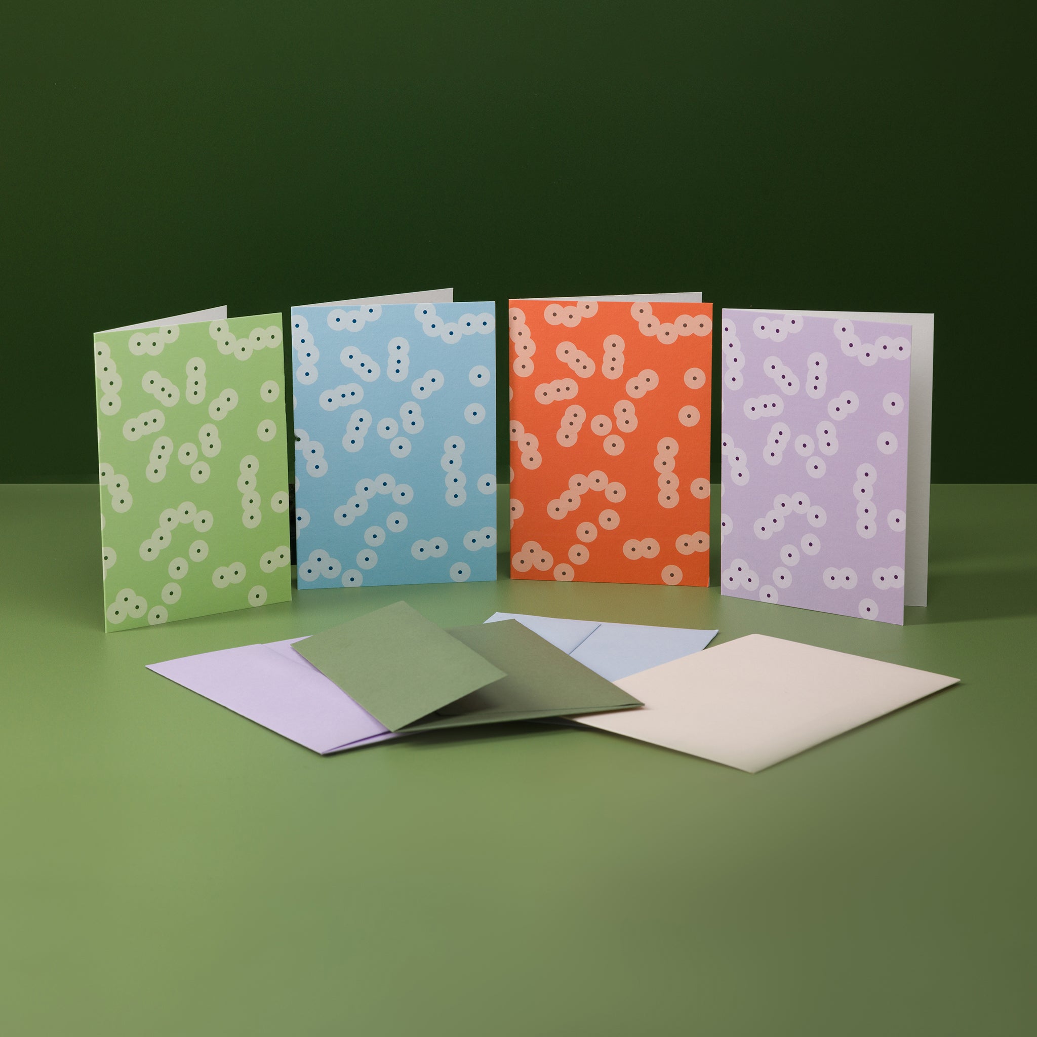 Bundle of four greeting cards from the Spawn range, in four colours: green, blue, orange and lilac