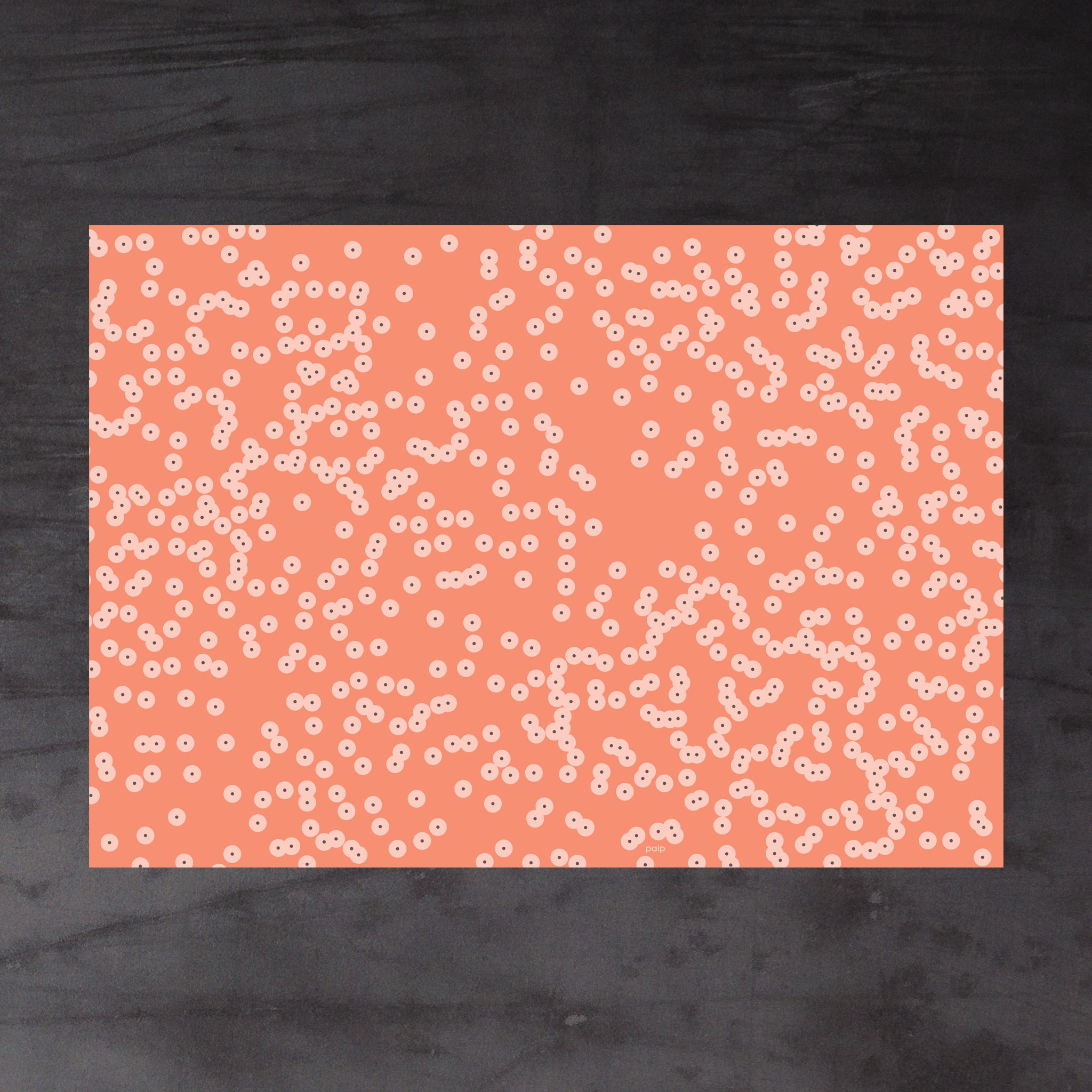 Aerial view of whole sheet of Spawn (orange) gift wrap in deep orange colour scheme. Pattern: irregular clusters of circle motifs, inspired by frog spawn
